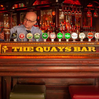 Barman pouring a pint at The Quay Bar