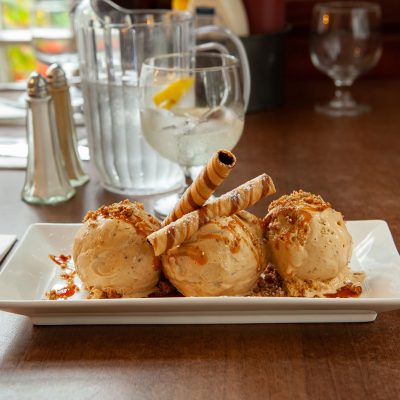 Salted caramel ice-cream with fudge crumb and crispy thin wafer topped with caramel sauce